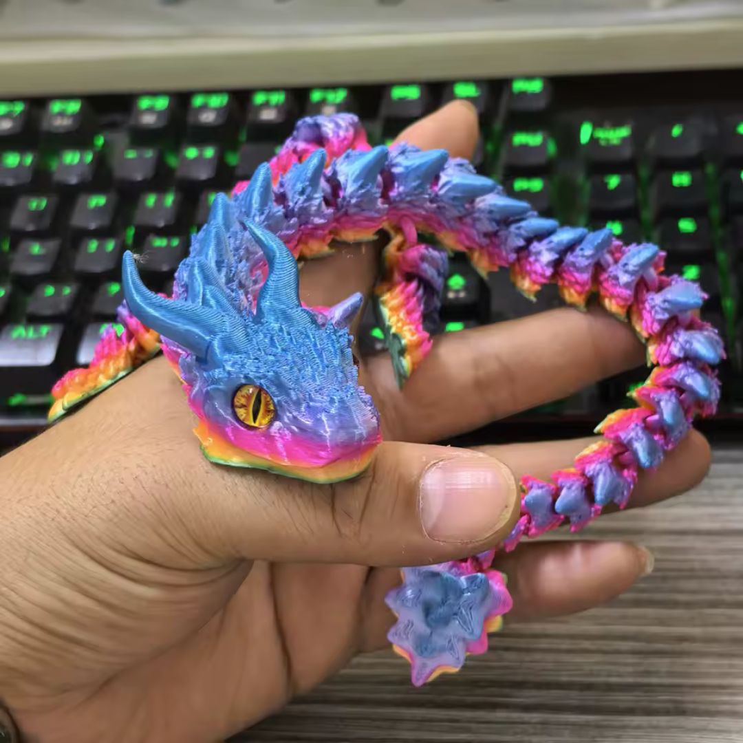 Fidget dragon articulé tricolore rose bleu